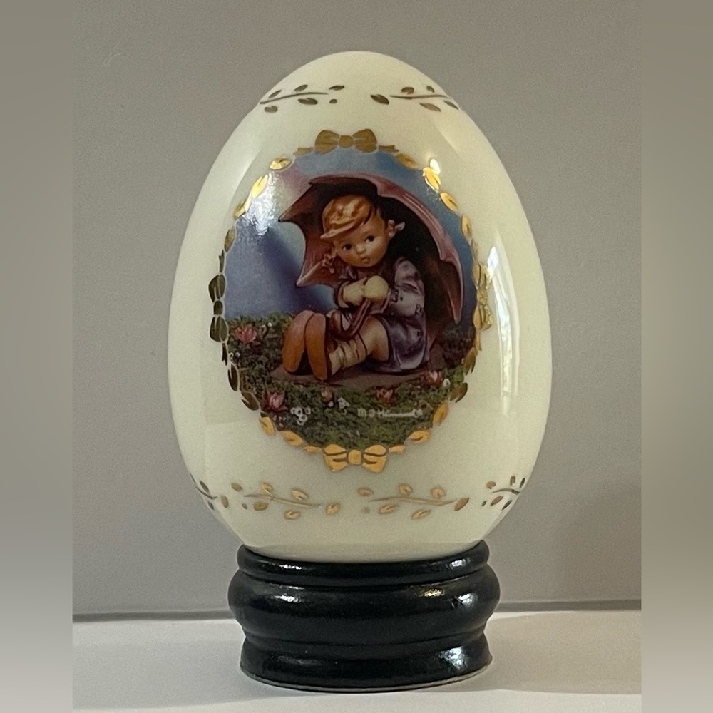 M.J. Hummel “UMBRELLA GIRL” Porcelain Ivory Egg.